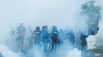 Security forces stand guard during a protest in Minneapolis, Minnesota, US. Reuters