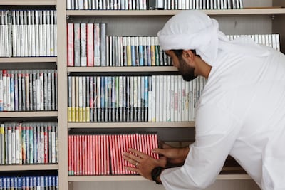 Omar Al Hashmi’s shelves hold games from PlayStation, Nintendo and Sega systems spanning two decades Chris Whiteoak / The National