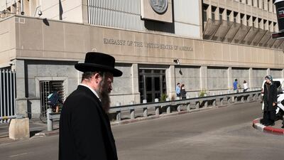 An ultra-Orthodox Jewish man passes the US Embassy in Tel Aviv, Israel on December 4, 2017, days ahead of expected announcement by US president Donald Trump on whether he would move it to Jerusalem as promised during his election campaign. Jim Hollander / EPA