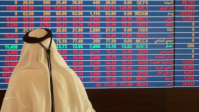 A trader monitors a screen displaying stock information at Qatar Stock Exchange in Doha. Naseem Zeitoon / Reuters