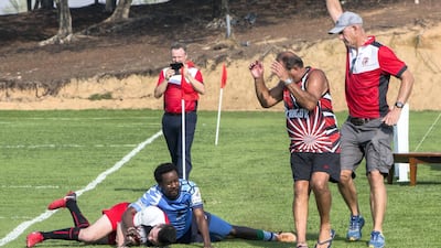 A RAK player is tackled over the line