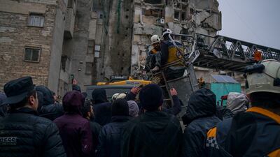A Syrian Civil Defence team recovering victims of the earthquake in Idlib. Moawia Atrash for The National