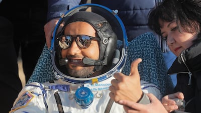 Hazza Al Mansouri gestures to spectators. AP Photo