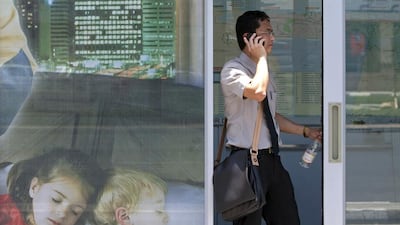 Mobile phone users in the UAE are now able to transfer their numbers between operators, but the TRA reports less than 5,000 have managed to make the switch. Jeff Topping / The National