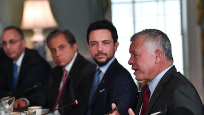 Jordan's King Abdullah speaks as Crown Prince Hussein looks on during a meeting with US Secretary of State Antony Blinken at the State Department in Washington.
