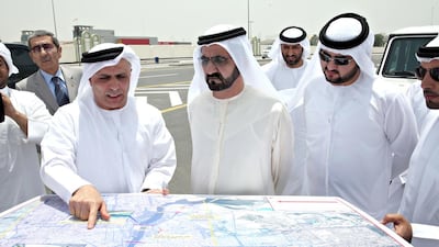 Sheikh Mohammed looks at plans for Al Ittihad Bridge in Dubai. Wam