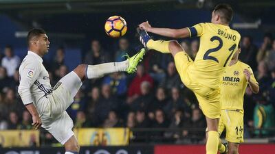 Real Madrid midfielder Casemiro, left, vies for the ball with Villarreal midfielder Bruno Soriano. Miguel Angel Polo / EPA