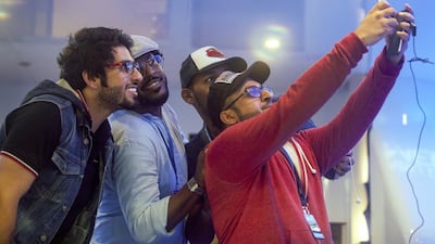 Saleh Al Ali and instagrammers at the Abu Dhabi Media Racing Lounge and yacht in Yas Marina during the Etihad Airways Formula One Abu Dhabi Grand Prix.