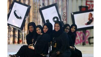From left, Asma Obaid, Maitha al Haddad, Maryam Sayed, Salma al Saadi, Mirah Ahmed and Fatma al Bastaki during the opening of the exhibition at Dubai Women's College. Pawan Singh / The National