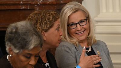 US Representative Debbie Wasserman Schultz, centre, speaks with Representative Liz Cheney at a ceremony honouring 17 medal recipients, including her late father, John McCain. AFP