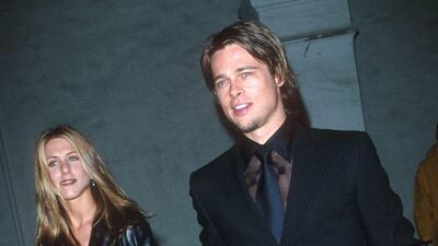 Jennifer Aniston and Brad Pitt, in all black, attend the MusicCares Benefit Dinner in Los Angeles, California, on February 21, 2000. Getty Images