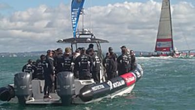 The crew of Emirates Team New Zealand are driven to the race boat before a race.