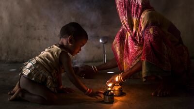 A young girl in West Bengal, India, plays with a kerosene flame inside a poor household in rural Bengal. More than six million Indian people suffer from fire burns every year, making India the burns capital of the world. These figures are related to the close proximity of housing in many areas, as well as the overwhelming use of an open flame for light, cooking and warmth. Despite these huge numbers, there are very few burns facilities for these victims and many are condemned to a painful, constricted life if they survive at all. Photo: Brent Stirton / Prix Pictet