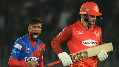 Karachi Kings' Mohammad Amir celebrates after taking the wicket of Islamabad United's Colin Munro during their PSL match. AFP