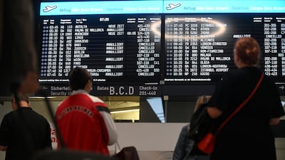 A departures board showing cancelled flights at Cologne Bonn Airport. Reuters