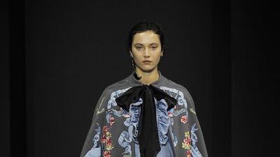 Temperley London’s collection featured oversized, dramatic bows cascading down the fronts of blouses with almost thigh-length tails. Catwalking / Getty Images