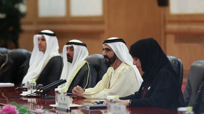Sheikh Mohammed bin Rashid leads the UAE delegation in China. Pictured with Sheikh Ahmed bin Saeed, second left, Reem Al Hashemi, UAE Minister of State for International Cooperation, right, and Khaldoon Al Mubarak, the Managing Director and Group Chief Executive Officer of the Mubadala Investment Company. AFP