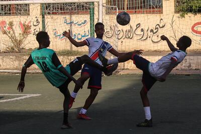 Young Sudanese footballers play a game in Cairo, Egypt. Getty Images.