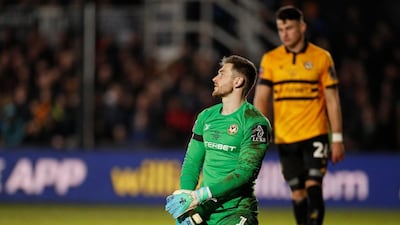 Newport goalkeeper Joe Day reacts after Manchester City's Phil Foden (not pictured) scored their second goal. Reuters