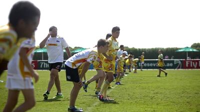 Retired New Zealand rugby star Josh Kronfeld held a series of drills youngsters at the Dubai Rugby Academy. Two Emiratis youths also took part in a bid to help continue to build a foundation for the sport in the UAE. Here, Kronfeld has the boys doing sprints. Lee Hoagland/The National