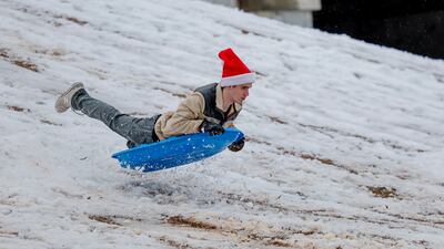 Tommy Huffstedtler, 17, sleds down a snow-covered hill in Avondale Estates, Georgia, US. EPA