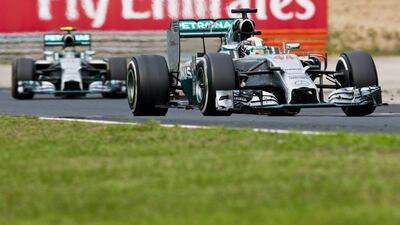 Lewis Hamilton, near, shown leading Mercedes teammate Nico Rosberg, far, during the Hungarian Grand Prix on Sunday, Drew Gibson / Getty Images / July 27, 2014