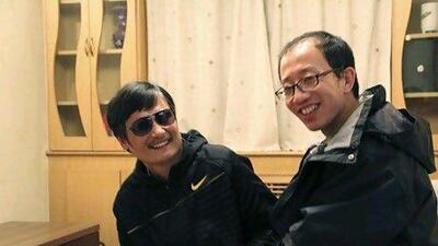 Chen Guangcheng, a blind legal activist, left, with Hu Jia, one of China's most prominent dissidents. Mr Chen is under US protection in Beijing after fleeing from house arrest.