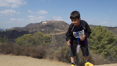 Khaled Nasser Al Otaibi of the UAE Junior Jiu-Jitsu National Team strikes a fighting pose in view of the iconic Hollywood sign on Thursday, October 16, 2014. Zachary Patton for The National