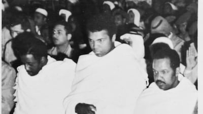 Ali prays inside the Grand Mosque in Makkah. He said that during a visit to the Prophet Mohammed's tomb in Madinah he became convinced that he could defeat Joe Frazier in the ring. Getty