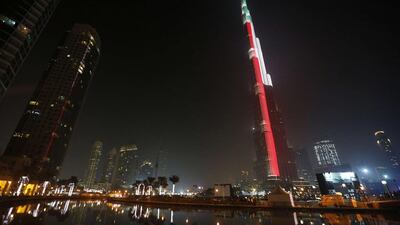 Lighting illuminates the Burj Khalifa tower in the colours of the Emirati flag in downtown Dubai during New Year celebrations. Karim Sahib / AFP PHOTO