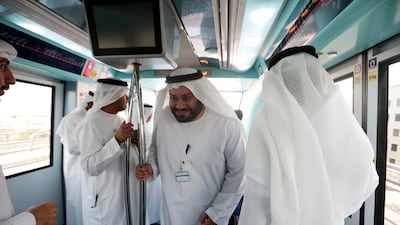 Staff from the Ministry of Justice take the metro to work for Car-Free Day, from the Etisalat metro station. The Dubai Municipality initiative aims to reduce carbon emissions and educate about global warming. Christopher Pike / The National