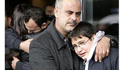 Relatives of passengers of the Ethiopian Airlines plane that crashed in the sea, comfort each other upon their arrival at Beirut airport.