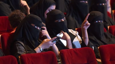 This photo taken on October 20, 2017 shows Saudi women attending the "Short Film Competition 2" festival at King Fahad Culture Centre in Riyadh. Saudi Arabia on Monday announced a lifting of the kingdom's decades-long ban on cinemas. Fayez Nureldine / AFP