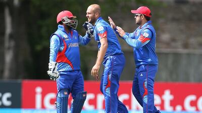 Mohammad Shahzad, left, single-handedly took Afghanistan home in chasing down a stiff 165-run target. Ian MacNicol / Getty Images