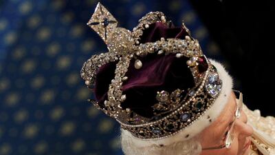 Queen Elizabeth wears a piece from the crown jewels during the state opening of parliament in 2010. REUTERS/Luke MacGregor