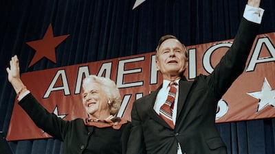 George HW Bush and his wife Barbara wave to supporters in Houston, Texas, after his 1988 presidential election victory.