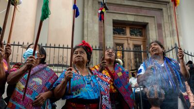 Indigenous Mayan authorities hold up their batons as they protest against Guatemala´s 201 years of independence from Spain, in Guatemala City. They also demanded the resignation of President Alejandro Giammattei. AP