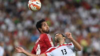 Habib Fardan of UAE (L) competes with Khamis Esmaeel of Iran during the Group C Asian Cup match between Iran and the United Arab Emirates at Brisbane Stadium in Brisbane, Australia, 19 January 2015. EPA/DAVE HUNT