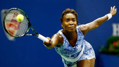 Venus Williams goes to play a return to sister Serena during their US Open quarter-final contest on Tuesday in New York City. Al Bello / Getty Images / AFP