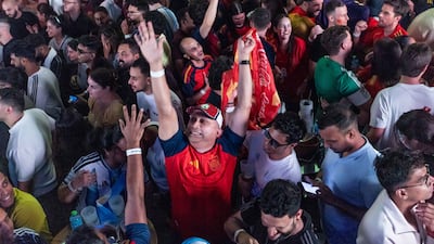 Spain supporters celebrate their team's World Cup final victory over Argentina at Bla Bla, Jumeirah Beach Residence, Dubai. Ruel Pableo for The National