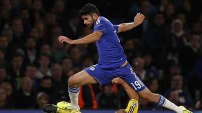 Chelsea's Diego Costa jumps over Maccabi Tel Aviv's Tal Ben Haim during his team's 4-0 Champions League win on Wednesday night. Adrian Dennis / AFP / September 16, 2015