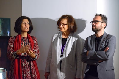 Sandi Hilal, left, and Alessandro Petti, right, with the curator of 'Permanent Temporariness', Salwa Mikdadi, at NYUAD. Khushnum Bhandari for The National