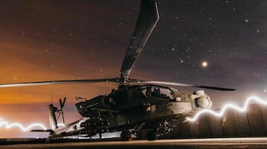 An US Apache helicopter is prepared for Operation Hawkeye Strike in Syria on December 19, 2025. Photo: US Air Force