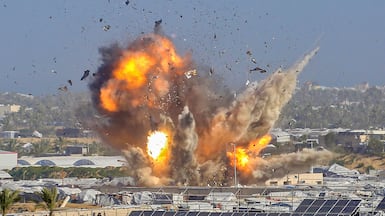Smoke and flames rise after an Israeli air attack on Khan Younis in the Gaza Strip killed dozens. AFP