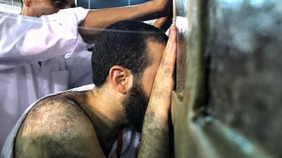 Muslim Hajj pilgrims touch Kaaba's wall and pray around the holy Kaaba at the Grand Mosque in Mecca, Saudi Arabia. EPA