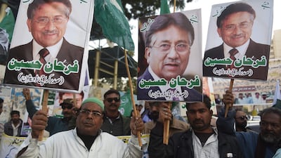 Supporters of the All Pakistan Muslim League (APML), the party of former military ruler Pervez Musharraf, carry placards during a protest following a special court's verdict in Karachi on December 18, 2019. AFP