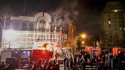 Smoke rises as Iranian protesters set fire to the Saudi embassy in Tehran. Mohammadreza Nadimi / Isna / AP Photo