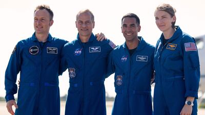 The astronauts looked relaxed as they arrived at the Kennedy Space Centre. AFP