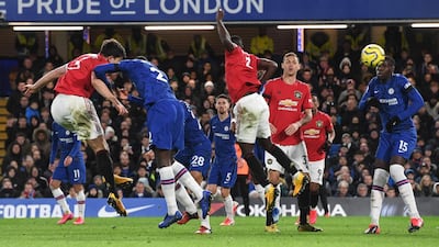 Harry Maguire, left, heads home the second goal. EPA