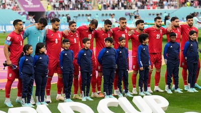 Iran's players stand in silence during their national anthem before their World Cup Group B match against England. AP